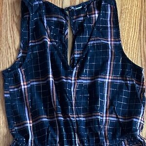 Super cute jumper with gold threaded through a unique plaid